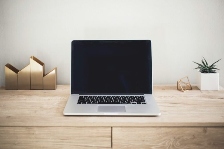 Minimal laptop workspace representing intentional AI use and AI minimalism