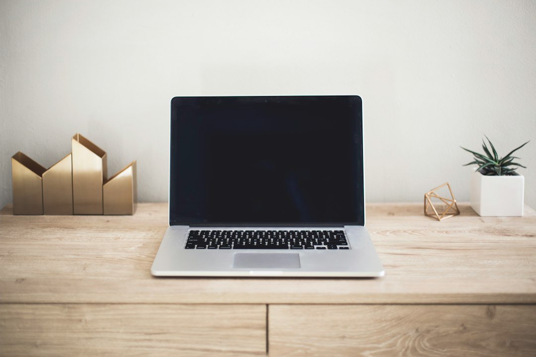 Minimal laptop workspace representing intentional AI use and AI minimalism