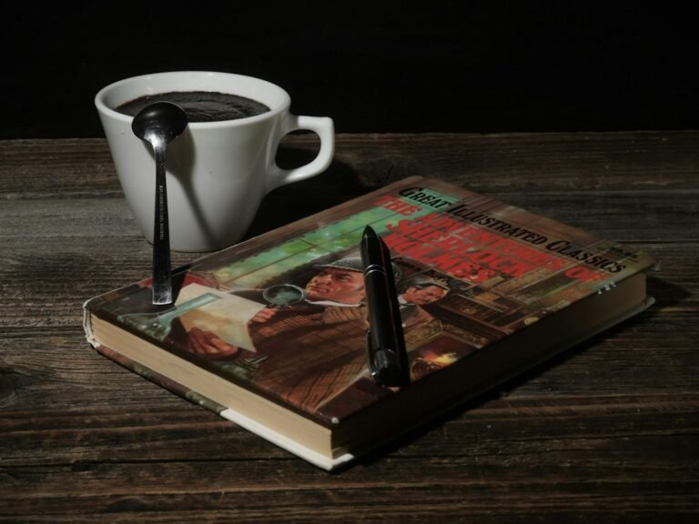 Book and warm drink illustrating cozy mysteries in 2026 and the growth of gentle whodunits