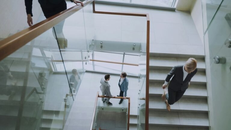 People walking stairs during a short movement break, illustrating exercise snacks