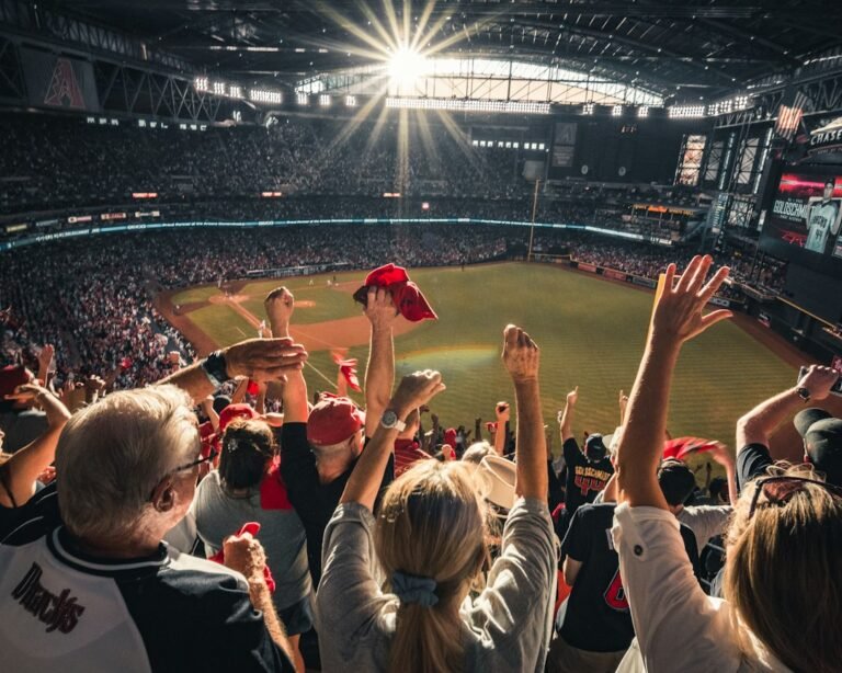 Fans celebrating at a stadium, illustrating sports tourism and travel built around live events