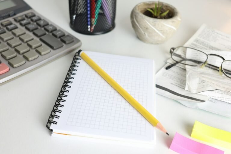 Notebook, pencil and study tools representing Major System number-memory exercises