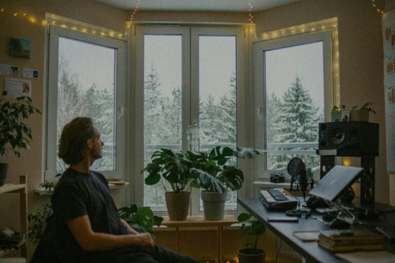 Person looking out of a window representing mind wandering and shifting attention