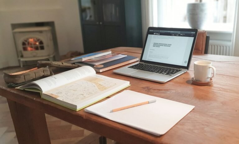 Laptop and research desk representing verification of AI-generated academic citations