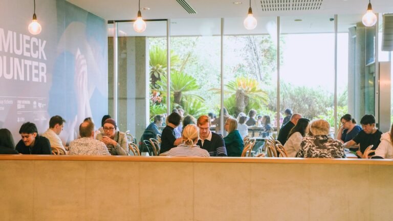 People gathering inside a cafe, illustrating the third place revival and offline community spaces